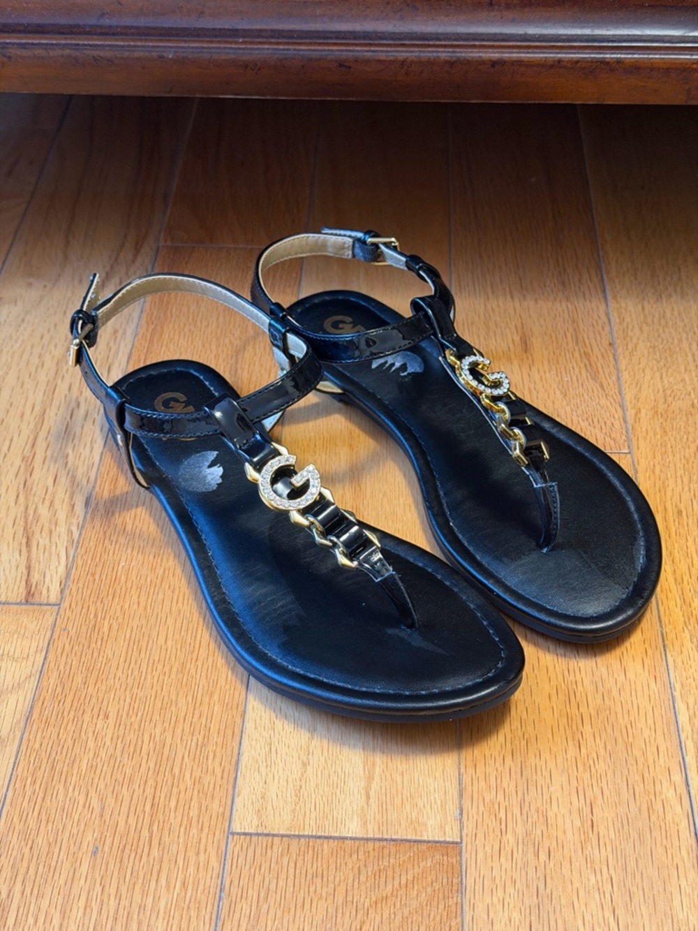 GBG Los Angeles Black T-Strap Sandals with Gold Chain Accent